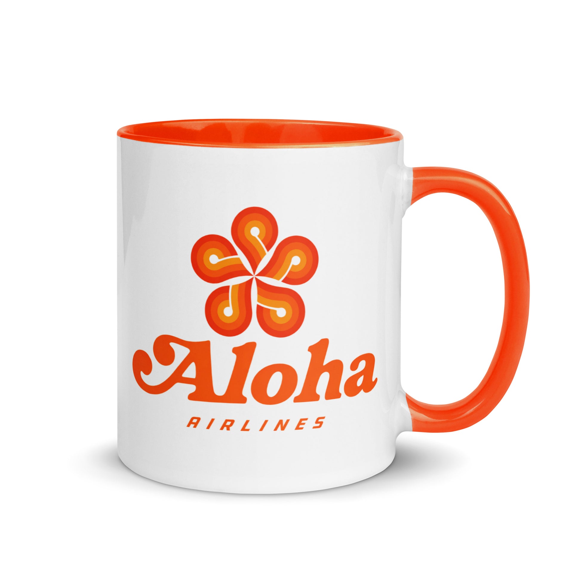 Aloha Airlines logo coffee mug featuring the classic Hawaiian flower emblem on a white ceramic mug with orange handle, perfect for aviation enthusiasts and island travel collectors.