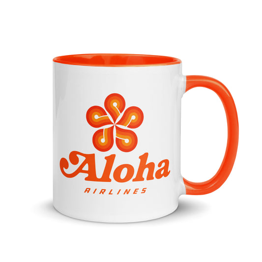 Aloha Airlines logo coffee mug featuring the classic Hawaiian flower emblem on a white ceramic mug with orange handle, perfect for aviation enthusiasts and island travel collectors.