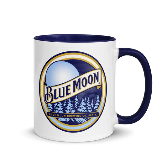 Blue Moon Brewing Company logo coffee mug featuring the iconic moonlit forest design on a white ceramic mug with blue handle, perfect for beer enthusiasts and collectors.