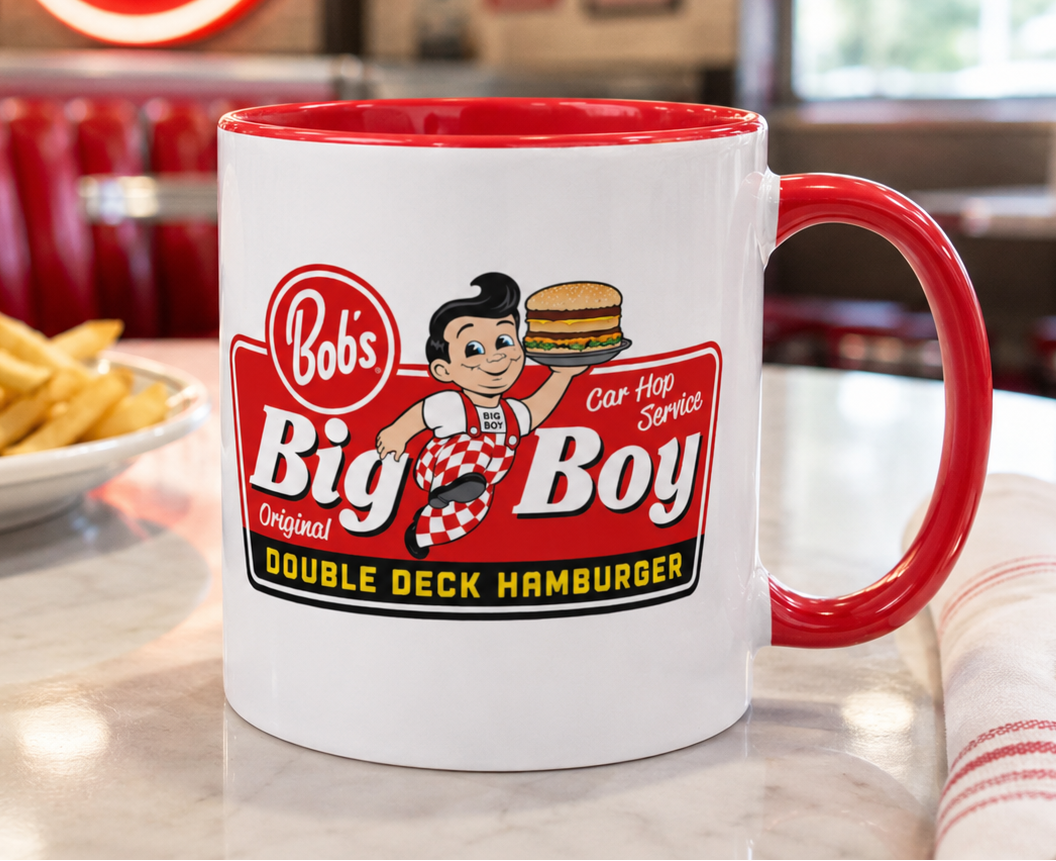 Bob's Big Boy logo coffee mug featuring the classic Big Boy mascot and Double Deck Hamburger design on a white ceramic mug with red handle and interior, perfect for retro diner fans and nostalgic restaurant memorabilia collectors.