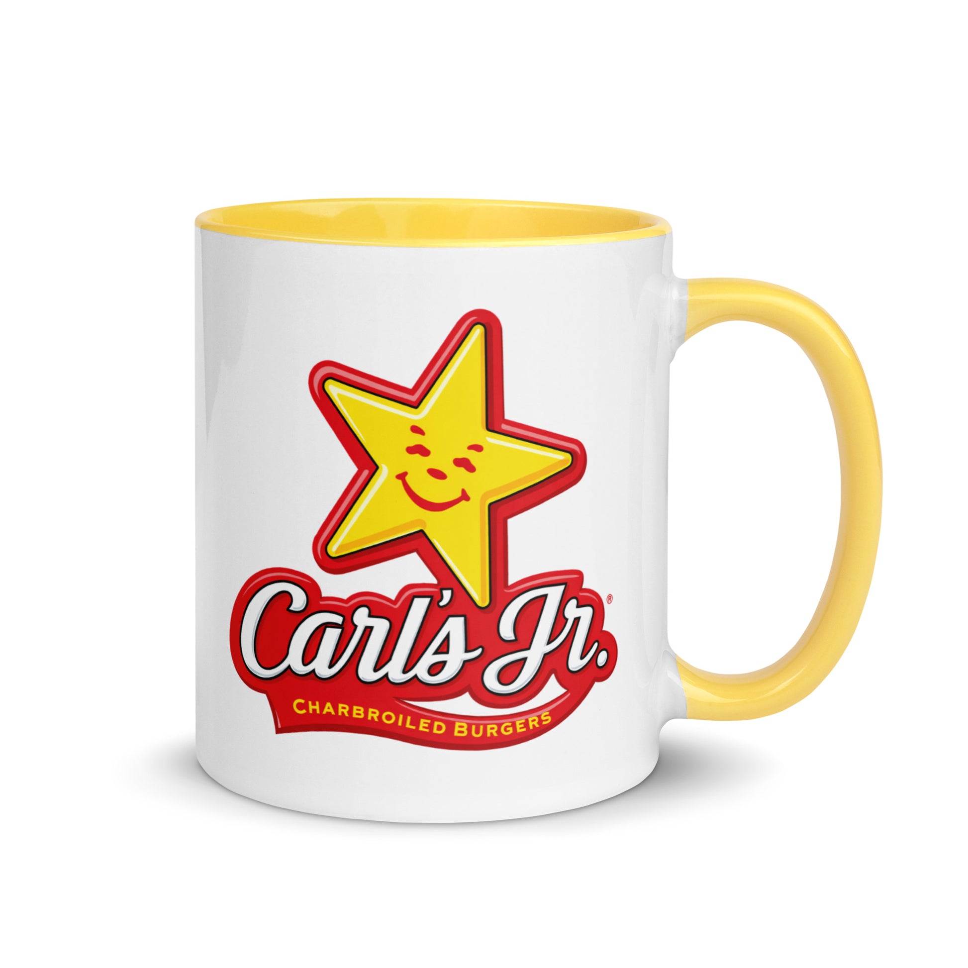 Carl's Jr. logo coffee mug featuring the iconic smiling star and charbroiled burgers branding on a white ceramic mug with yellow handle and interior, perfect for fast food memorabilia collectors.