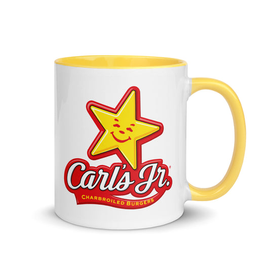 Carl's Jr. logo coffee mug featuring the iconic smiling star and charbroiled burgers branding on a white ceramic mug with yellow handle and interior, perfect for fast food memorabilia collectors.