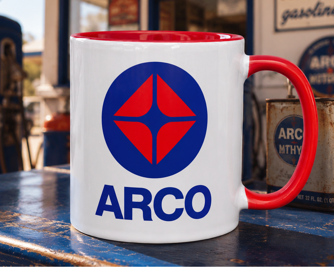 Classic ARCO gas station logo coffee mug featuring iconic red and blue petroleum brand design on white ceramic with red handle and interior.