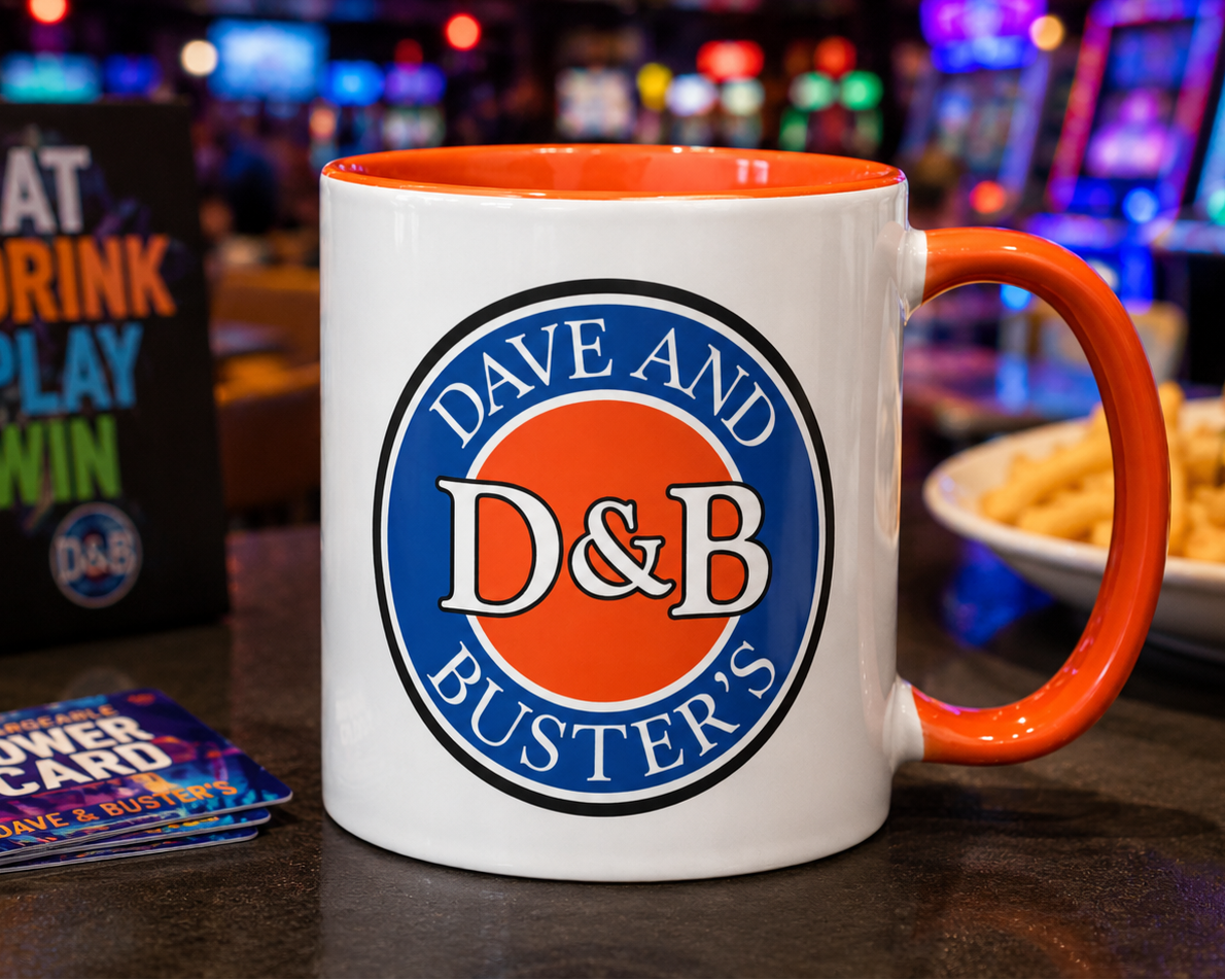 Dave & Buster’s 11 oz ceramic coffee mug featuring classic blue and orange D&B logo with bright orange handle and interior