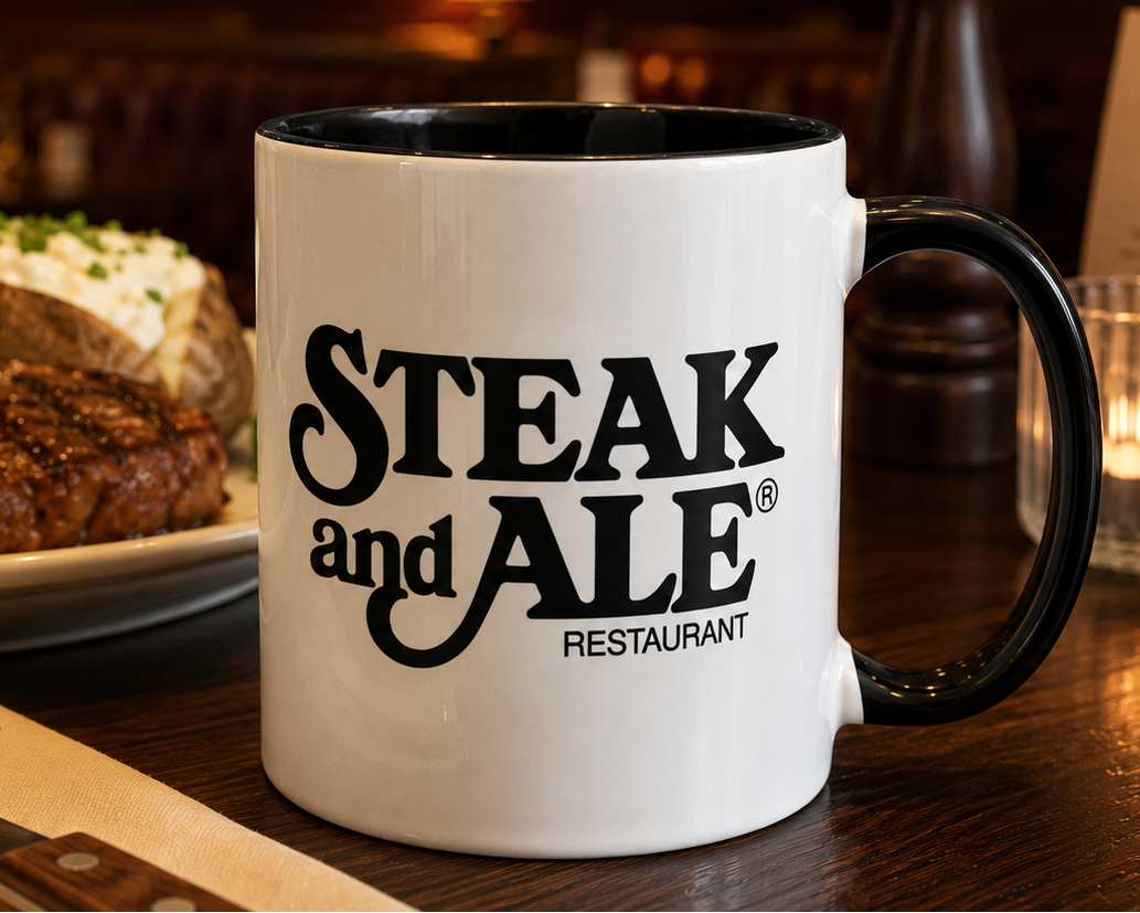 Classic Steak & Ale restaurant logo coffee mug featuring the iconic black vintage design on white ceramic with black handle and interior.