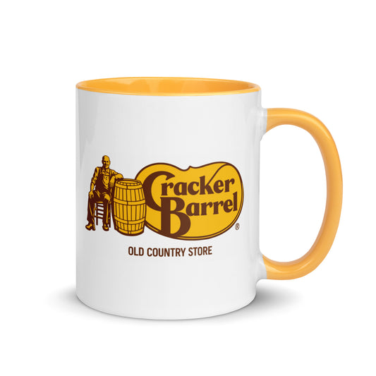 Cracker Barrel Old Country Store logo coffee mug featuring classic restaurant branding on a white ceramic mug with yellow handle and interior, perfect for country restaurant fans and collectors.
