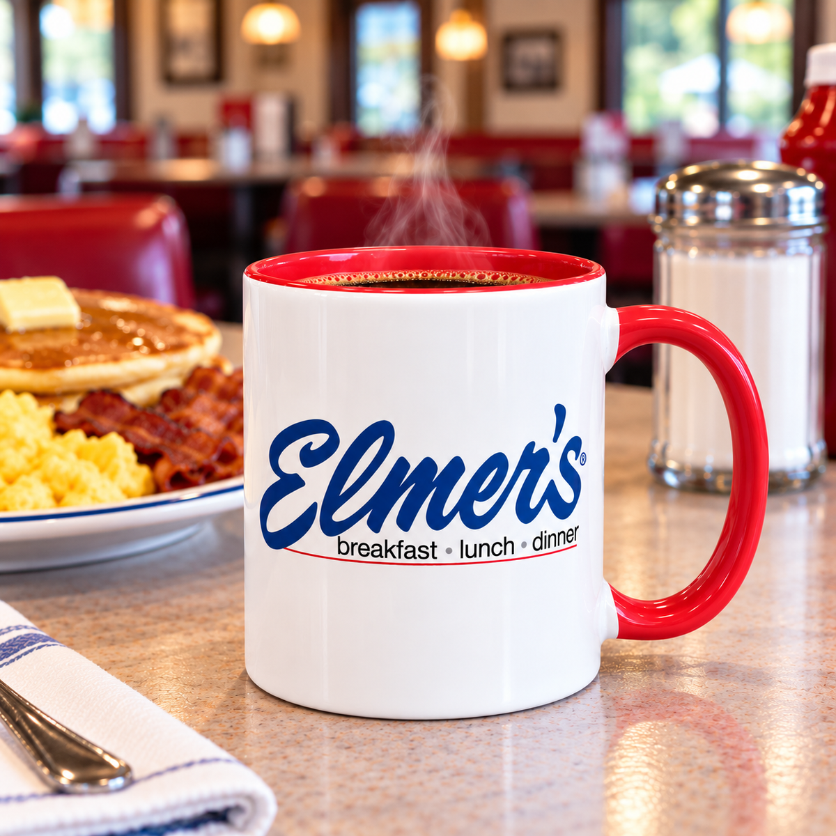 Elmer’s Restaurant logo ceramic coffee mug featuring classic blue diner logo with red accent handle