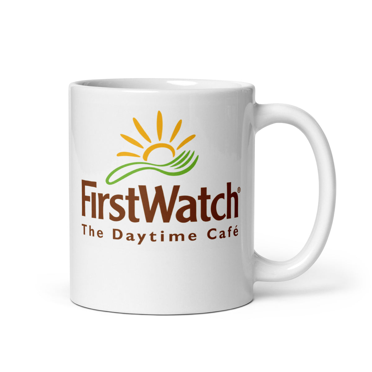 First Watch The Daytime Café 11 oz white ceramic coffee mug featuring the classic restaurant logo with yellow sun and green accents