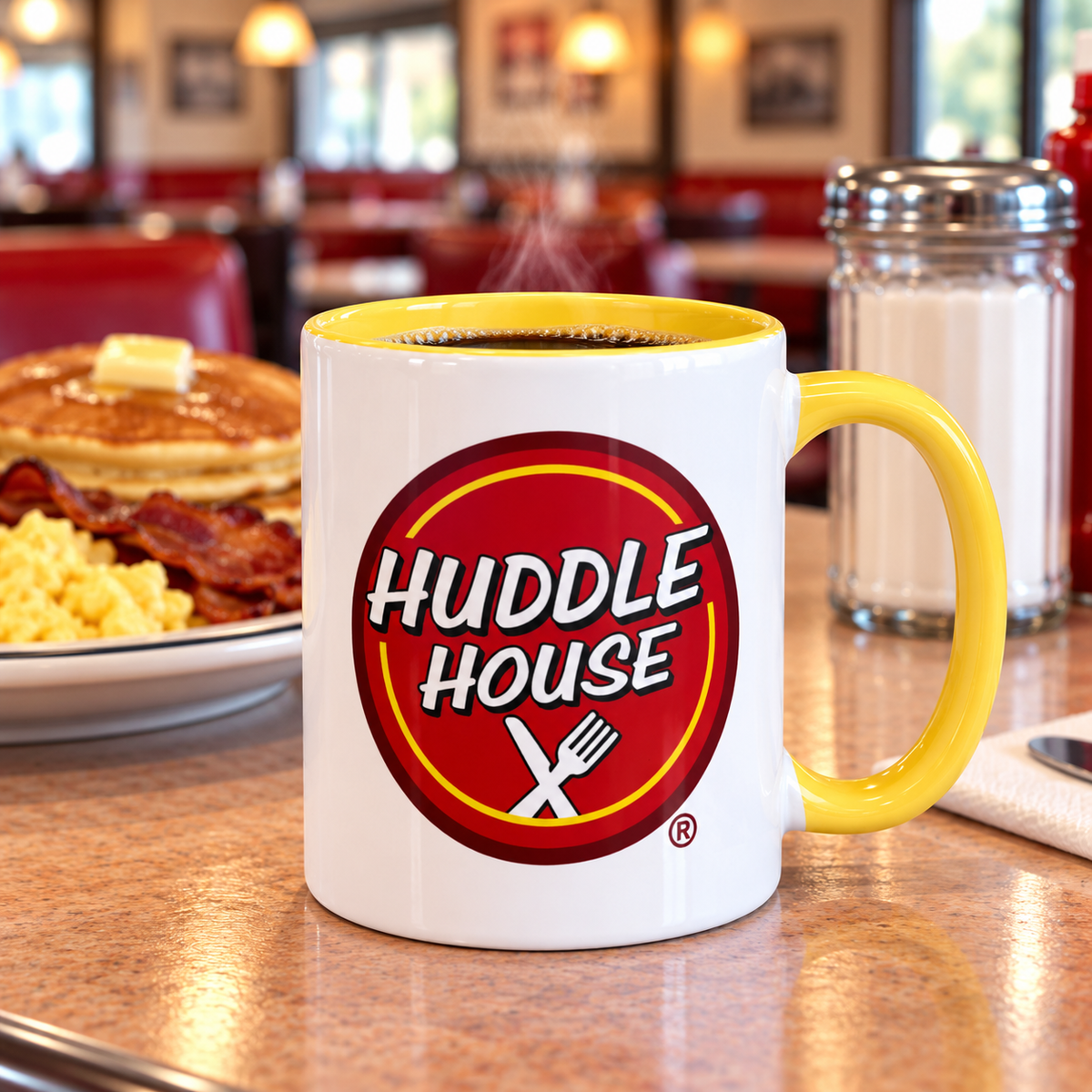 Huddle House logo ceramic coffee mug featuring classic red diner restaurant design and yellow accents