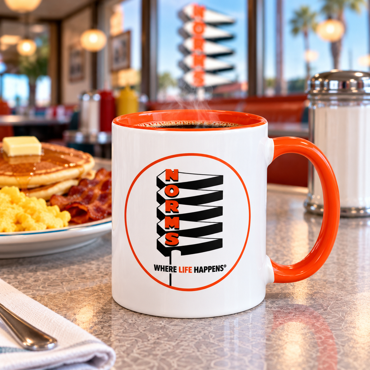 NORMS Southern California diner coffee mug featuring classic restaurant logo on white ceramic with orange accents