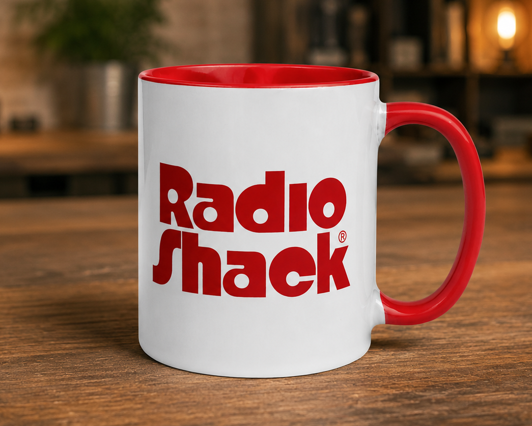 RadioShack logo coffee mug featuring the classic vintage red RadioShack logo on a white ceramic mug with red handle and interior, perfect for electronics enthusiasts and retro technology collectors.