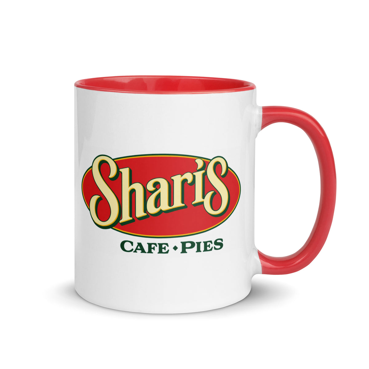Shari’s Café & Pies 11 oz white ceramic coffee mug featuring the classic red and yellow restaurant logo with matching red interior and handle