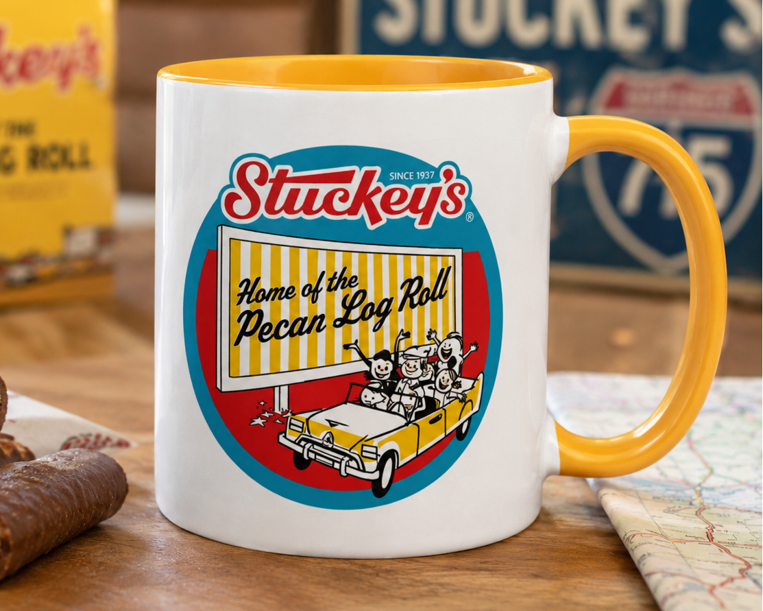 Retro Stuckey's souvenir coffee mug with colorful roadside sign design celebrating the iconic Pecan Log Roll, ideal for vintage travel memorabilia collectors and highway nostalgia lovers.