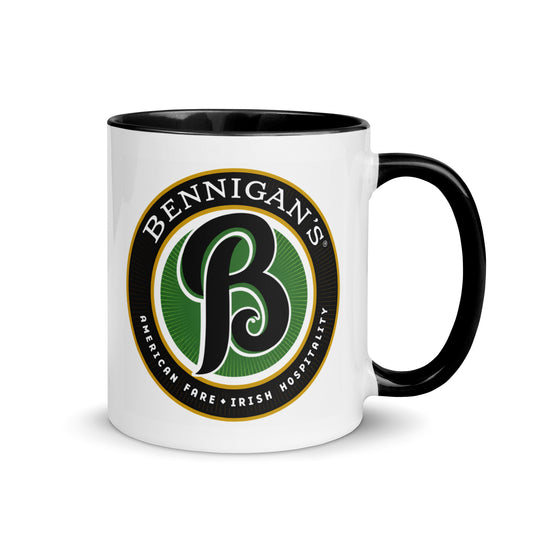 Vintage Bennigan's logo coffee mug featuring the classic Irish Hospitality emblem on a premium white ceramic mug with a black interior and handle, perfect for restaurant nostalgia fans and pub memorabilia collectors.